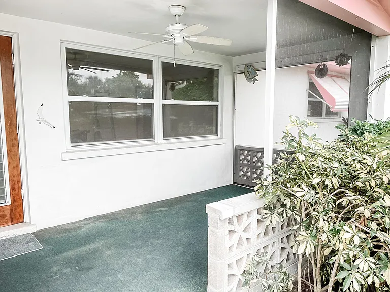 A great little front porch area. Add a few wicker chairs to make it the perfect spot for sitting out in the evening.