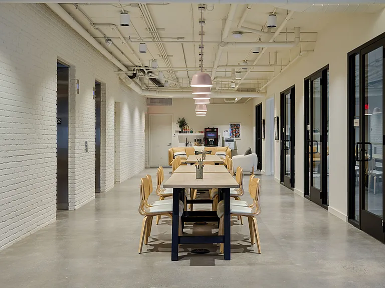 Community co-working area with private meeting rooms and offices