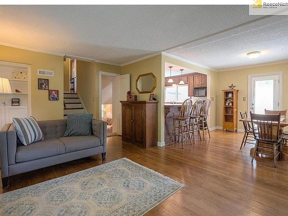 Open floor plan throughout living room, dining room and kitchen.