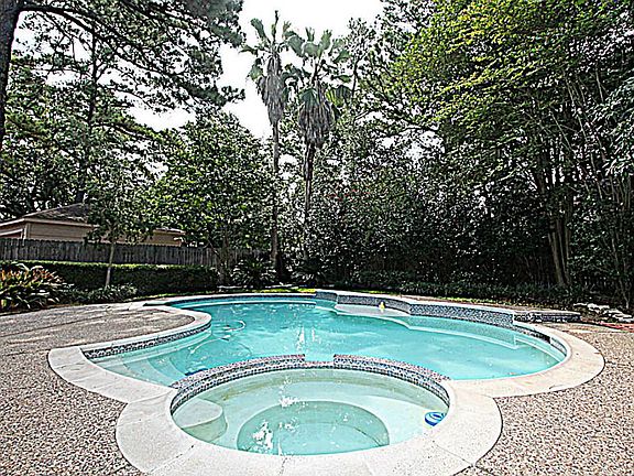 INDULGE IN THIS GLISTENING POOL AND SPA