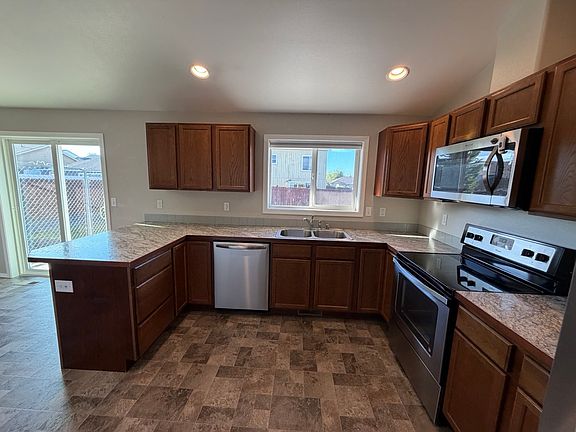 Large kitchen featuring stainless steel appliances.