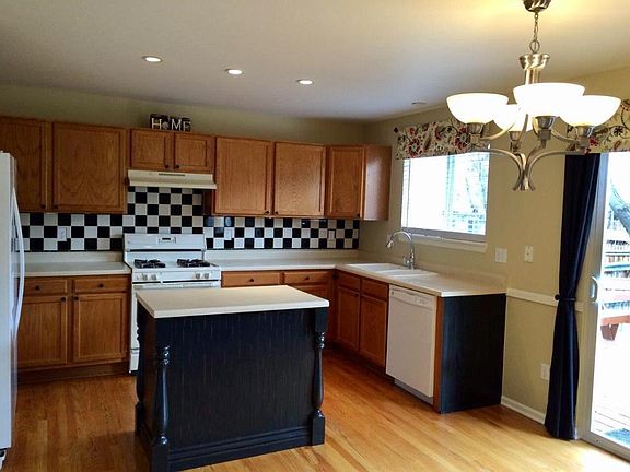 New stainless steel dishwasher, microwave, and stove not pictured. Cabinets will be white.