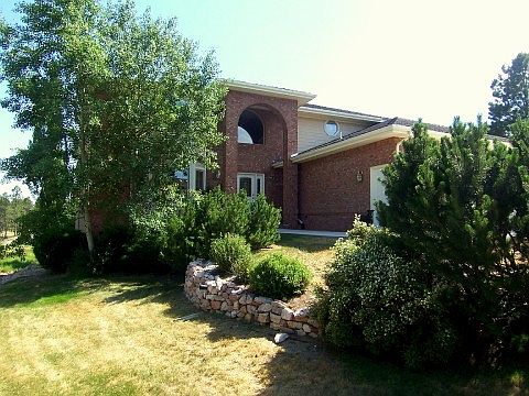 Beautifully Landscaped with Mature Trees & Shrubs