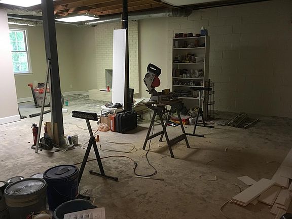 Unfinished basement with full bathroom