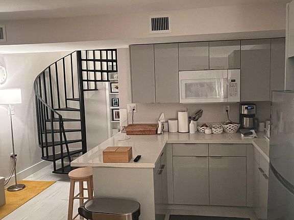 Kitchen & Stairs to Loft primary bedroom