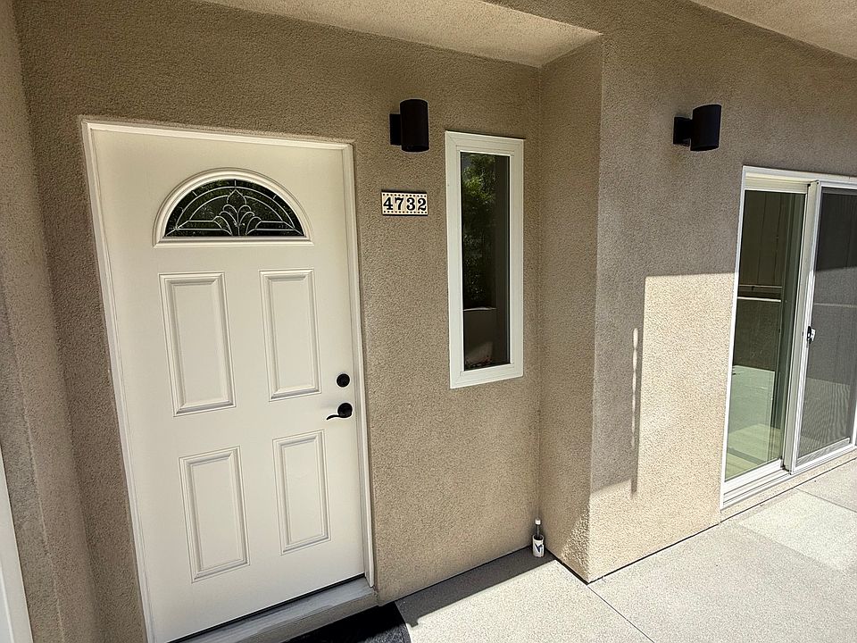 Front door of property with view of patio doors from first floor bedroom