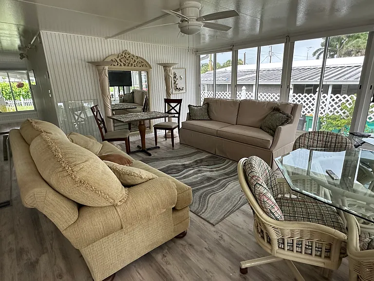 An additional, 500 sq ft of beautifully finished enclosed lanai (used as family room and work shop) under A/C added to house in 2010. Making the property over 2,000 sq ft under A/C.