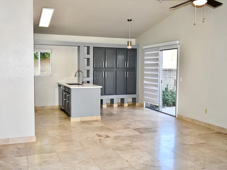 View of the Living Room from the front door. Travertine floor throughout.