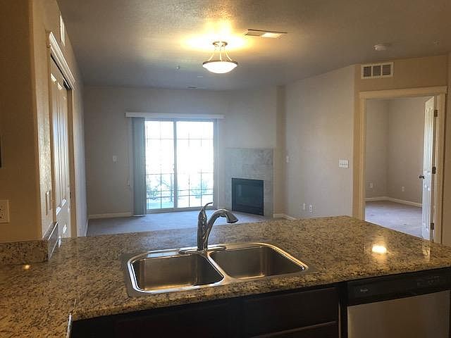 Kitchen opens to Living room with fireplace