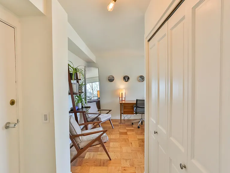 Enter to the left, to a sitting area and desk.
