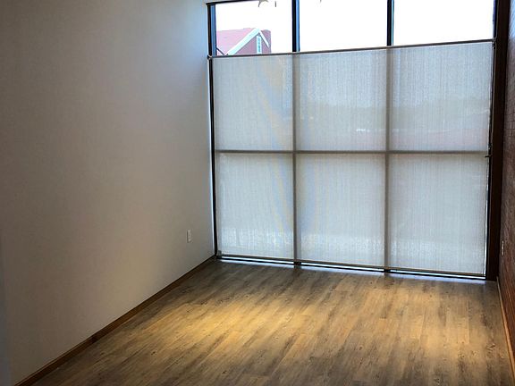 Floor to ceiling windows with privacy tinted glass. Custom window shade .