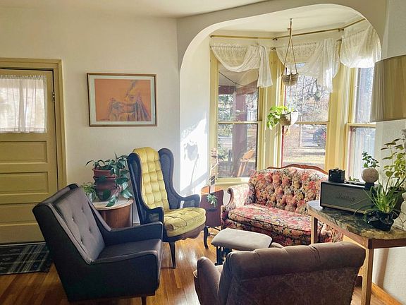 Bay window in living room with front door