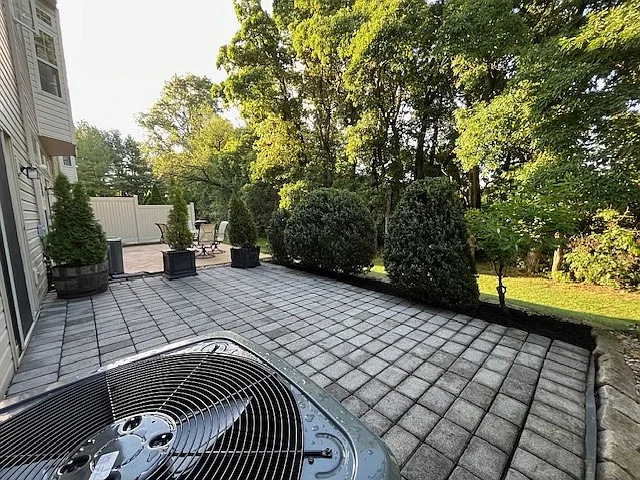 First floor paved patio and backyard