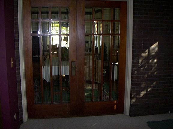 Original french doors from lead from dining to modern addition