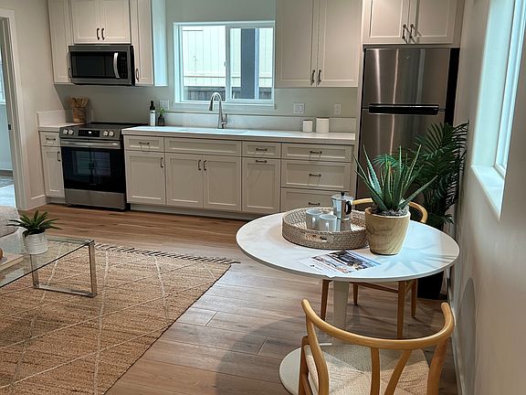 Kitchen features a range, microwave oven and refrigerator