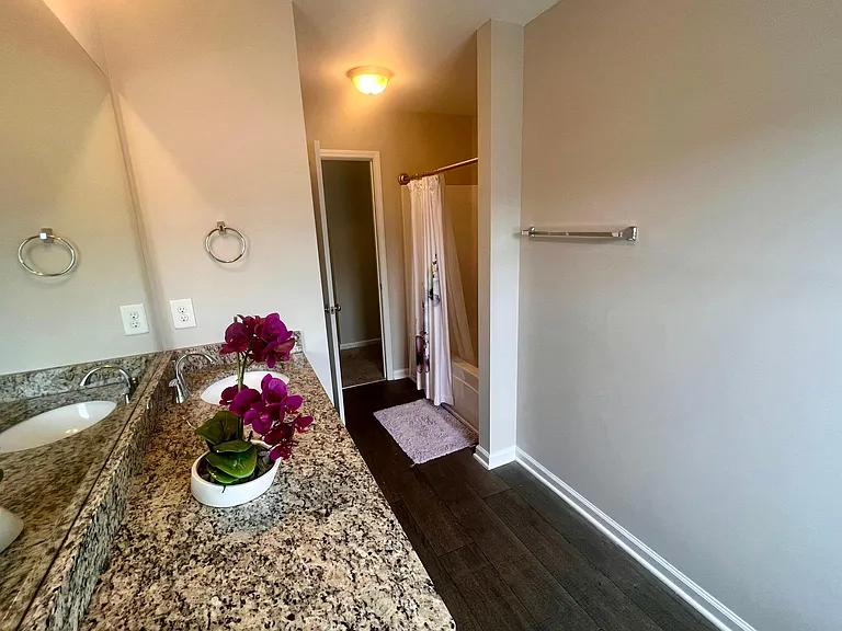 Upstairs main bathroom with granite as well.