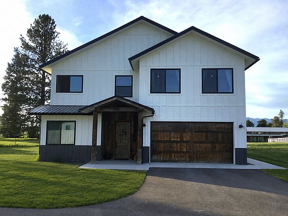Beautifully set within Cowboy Drive Estates, this newly built Montana retreat offers peaceful mountain views, charming ranch-style fencing, and a private setting surrounded by open skies and natural beauty.