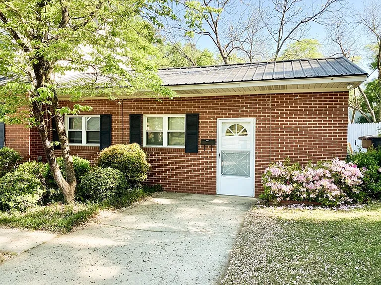 Front door to apartment with independent driveway.