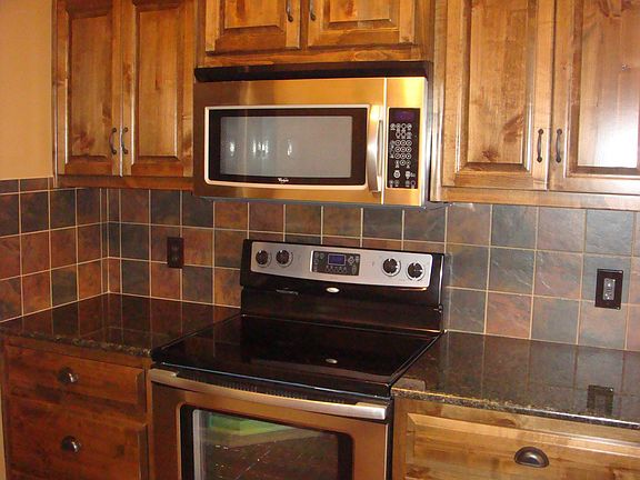 Granite counters Tile backsplash