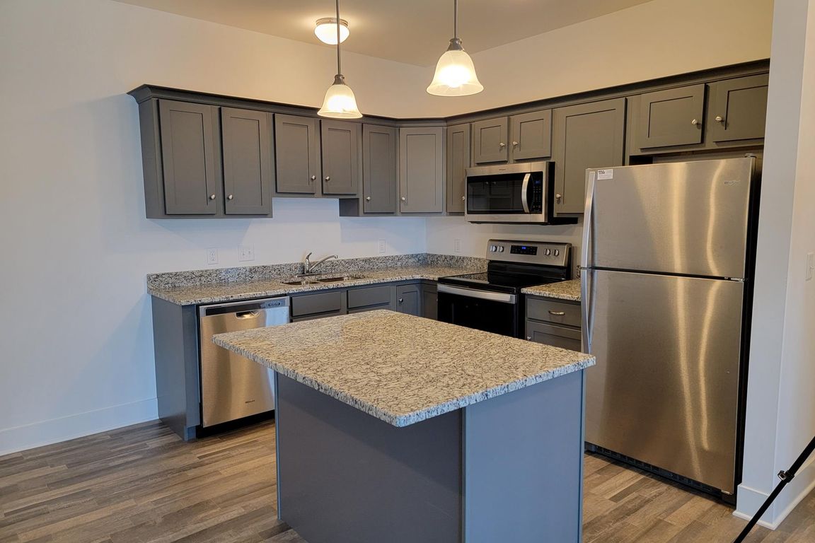End Unit - Kitchen with Granite Countertops and Stainless Steel Appliances