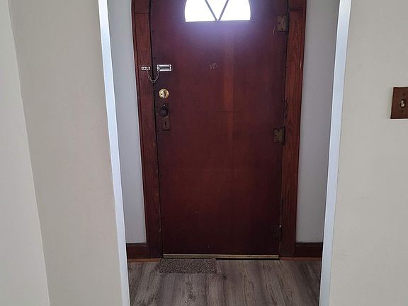 Arched entryway welcomes you home with cozy charm.