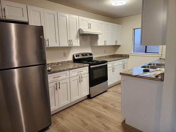 Kitchen. Stainless steel refrigerator and stove. New countertops and cupboards and sink!
