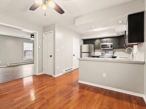 Eat in kitchen with deck off to right and family room off to left. 1/2 bath accessed off kitchen