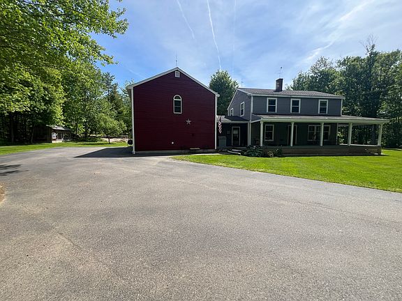 Apartment is located over the large garage