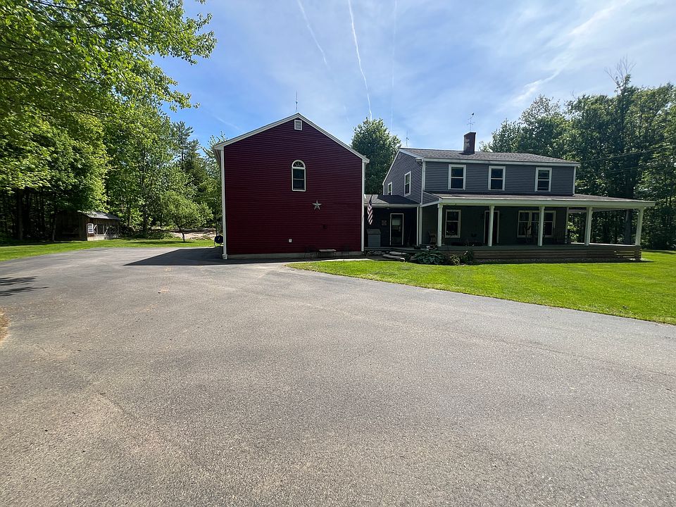 Apartment is located over the large garage