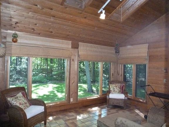 Vaulted ceilings and skylights anchor this awesome sunroom!