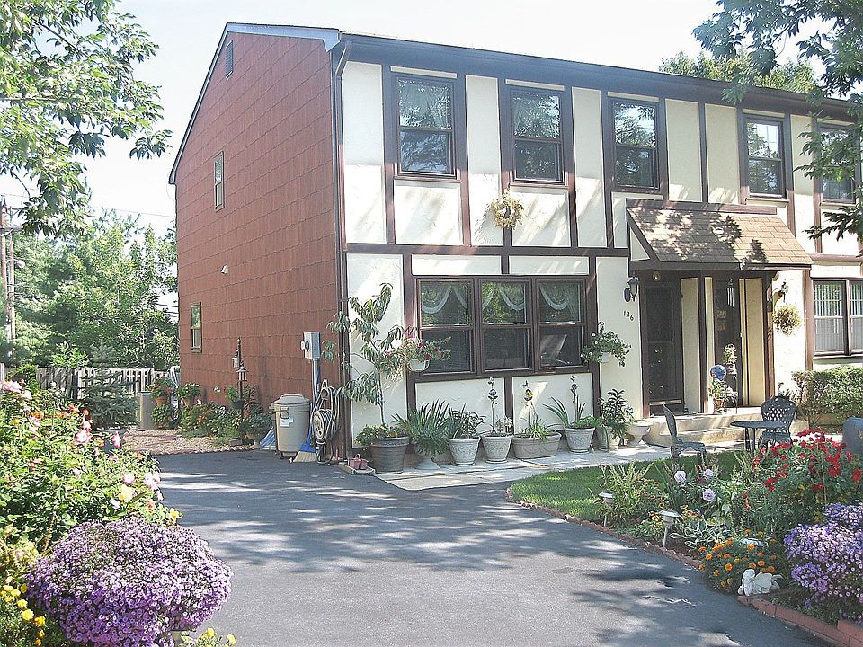 Stucco style in front & Oversized Private Driveway
