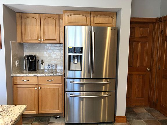 Coffee station with Keurig and drip coffee pot. Oversized fridge.