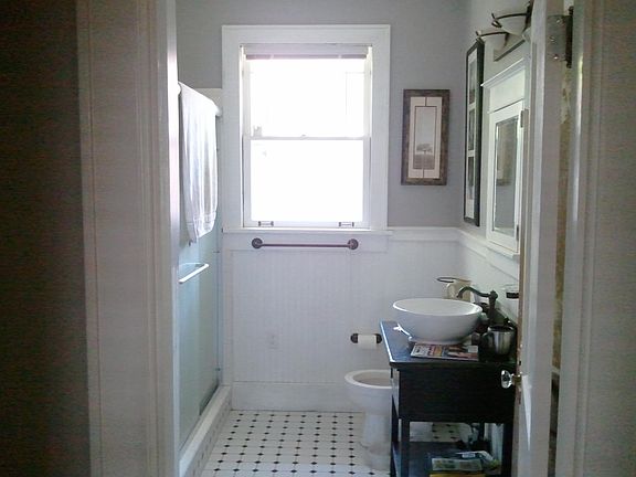 Bath with step in shower on left