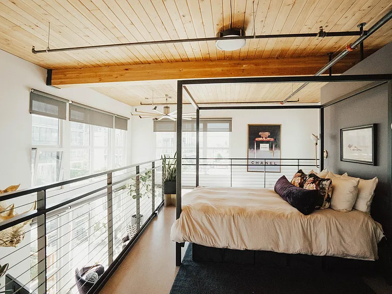 Lofted Bedroom with large custom closet system, backlit mirror and vanity (not pictured)