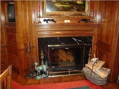  This is a photo of the fireplace in the study. There are 8 fireplaces in the 