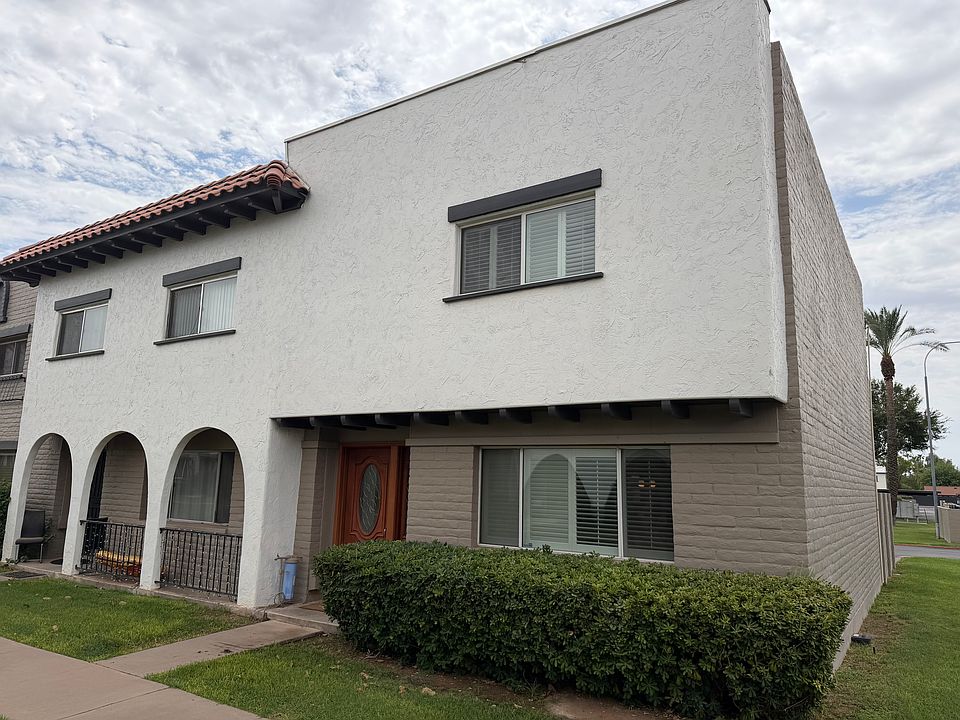 Front of Townhome - large grass areas surround.