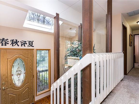Looking down the hall toward the bedroom wing on the main level.