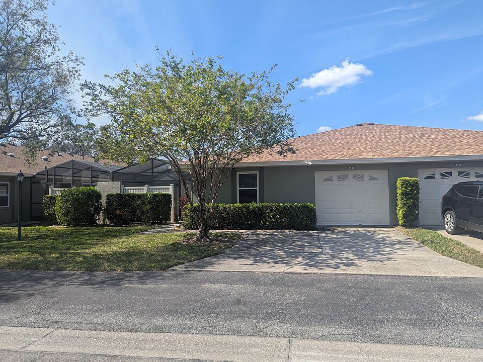 Front Of Condo. 2 cars fit in the driveway, Single car garage included.