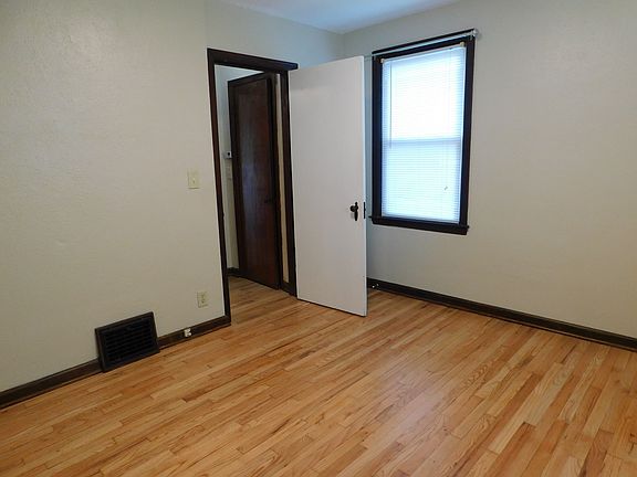 living room looking at front door to common entry