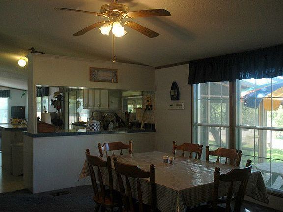 Dining to kitchen and deck in second home.