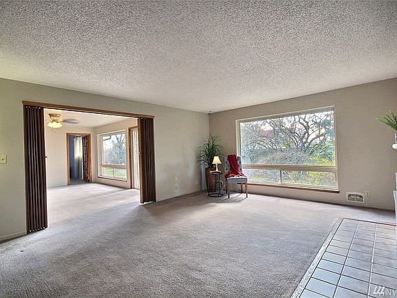 Spacious family room with large picturesque window.