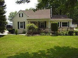 Front view of home, home sits well off the road