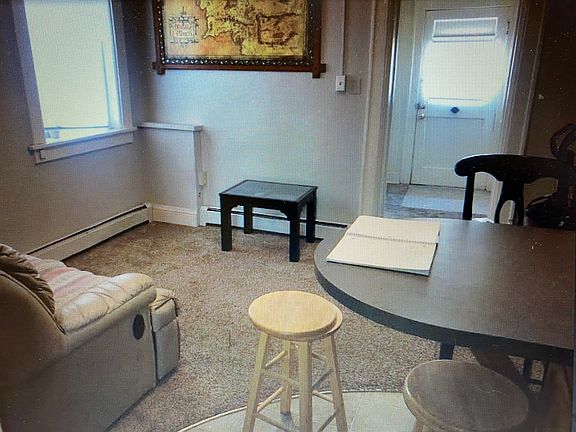 Open floor plan of the living space and kitchen area with eating space at the island counter space.