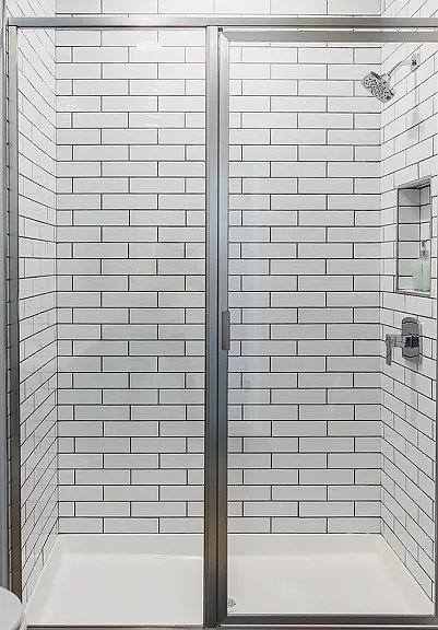 Oversized showers with glass surrounds and rain shower heads