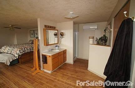 Children's Bedroom
						:
						Bedroom that includes built-in beds with storage underneath