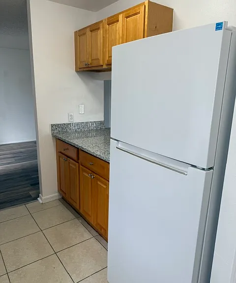 Refrigerator next to pantry