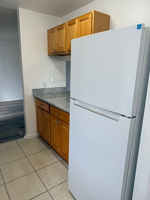 Refrigerator next to pantry