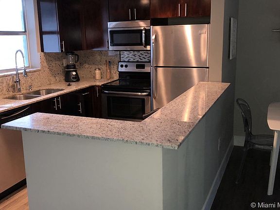 Kitchen Area with granite countertops and stainless steel appliances