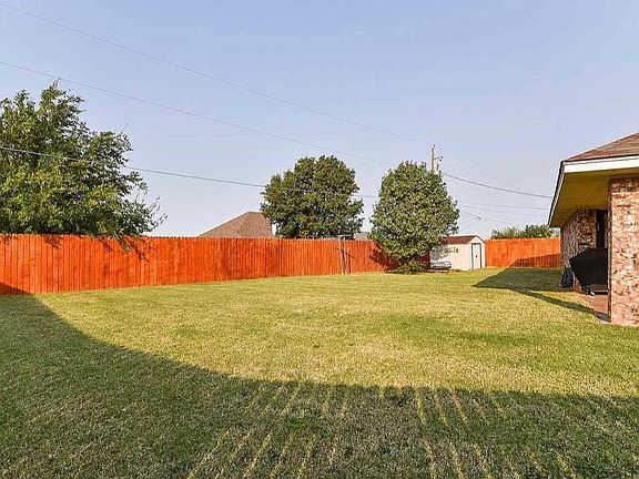 Very large fenced backyard with shed for extra storage