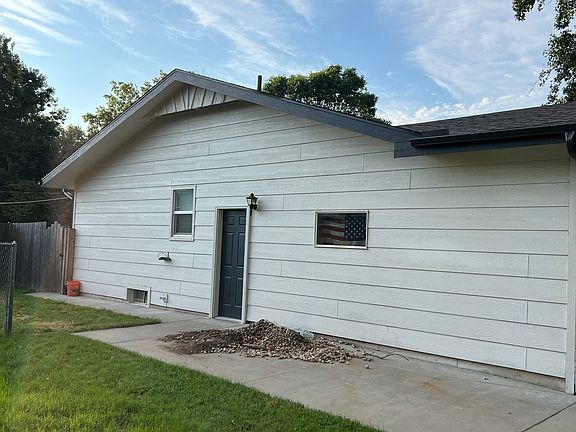 Side Door to garage off of extra parking on north side of house